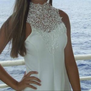 Short white dress w/ high neck design & open back